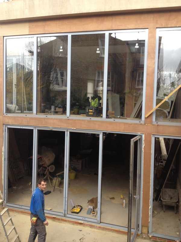 Aluminium bi-fold doors with two-storey glazing in Kingston upon Thames